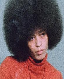 older photograph of young woman with Afro